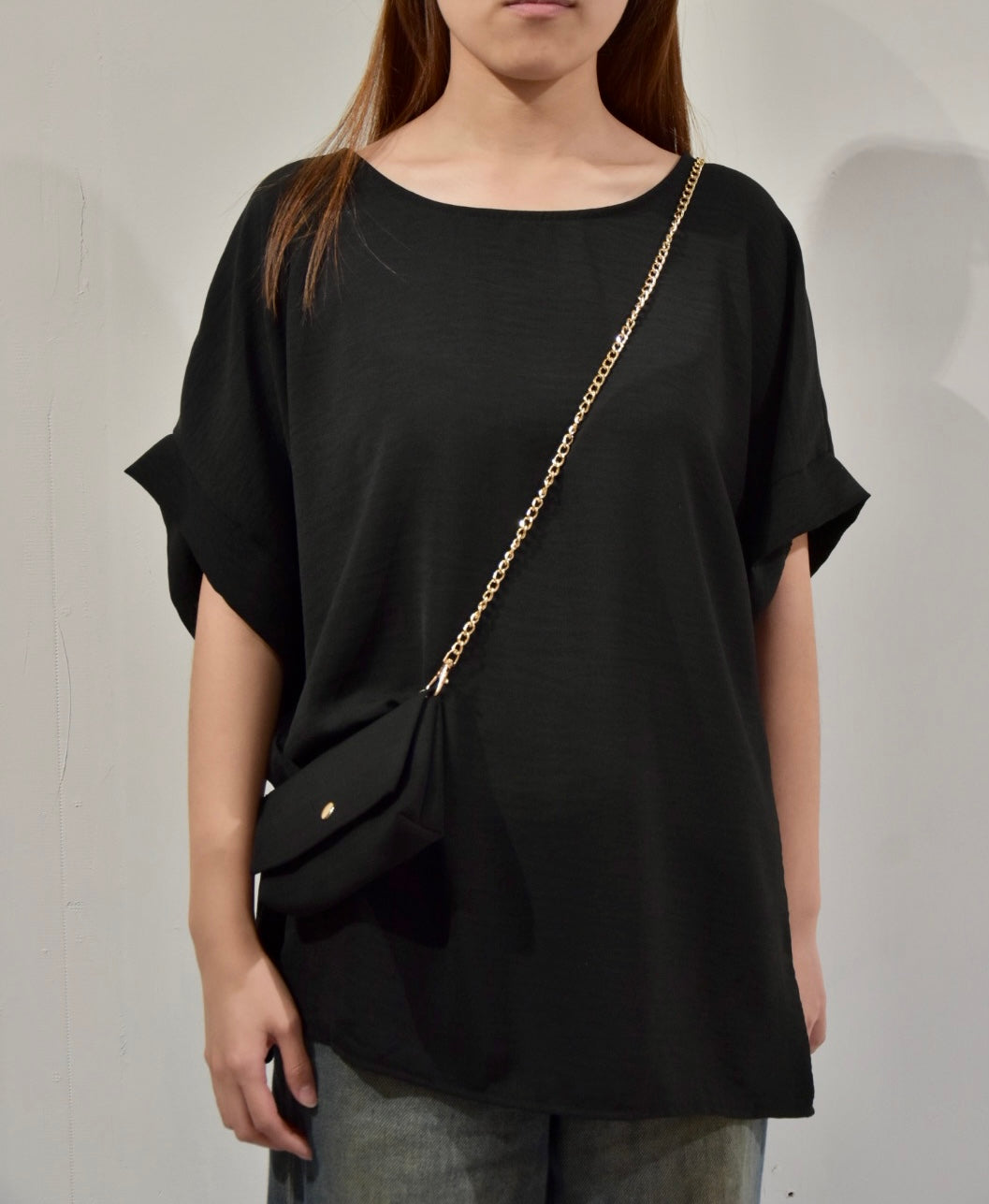 black top with chain bag