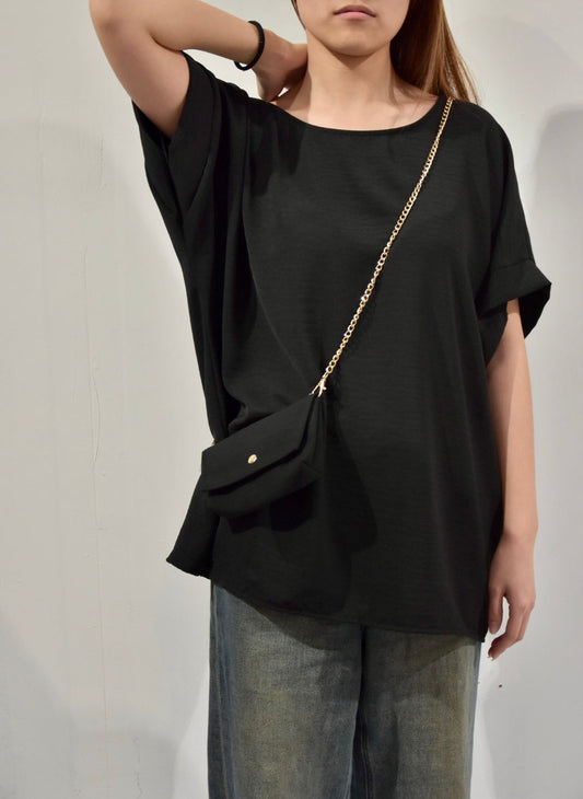 black top with chain bag